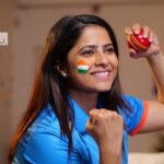Female cricketer hitting a shot during a match, symbolizing the growth of women's cricket